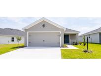 Charming single-Gathering home featuring a two-car garage and nicely manicured lawn at 559 Sw 77Th Cir, Ocala, FL 34474