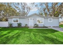 Charming single-story home with a well-manicured lawn and inviting front entrance at 5225 Golden Gate Blvd, Polk City, FL 33868