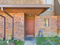 Charming brick home featuring a covered entryway and a decorative front door at 1836 N Crystal Lake Dr # 46, Lakeland, FL 33801