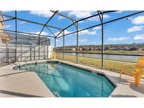 Enjoy the beautiful backyard pool, screened in, with lovely lake views at 531 Las Fuentes Dr, Kissimmee, FL 34746