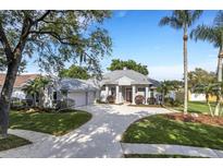 Stunning curb appeal, with circular driveway and lush landscaping at 5933 Lake Victoria Dr, Lakeland, FL 33813