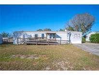 Single-wide manufactured home with ramp access at 4307 Meadow Ridge Ct, Mulberry, FL 33860