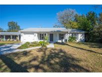 Charming single story home with gray exterior and landscaped lawn at 2226 Cordova N Cir, Lakeland, FL 33801