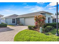 Single-story home with attached garage and landscaped front yard at 3441 Grenville Dr, Winter Haven, FL 33884