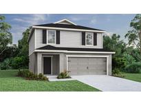 Two-story house with gray siding, black shutters, and a two-car garage at 447 Ituna Cir, Winter Haven, FL 33881