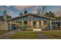 Charming bungalow with a welcoming front porch and nicely landscaped yard at 212 W Park St, Lakeland, FL 33803
