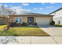 One-story home with a two-car garage and well-manicured lawn at 4710 Osprey Way, Winter Haven, FL 33881