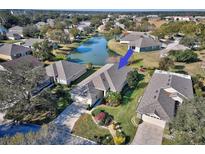 Single-story house nestled in a community near a lake at 6555 Lake Clark Dr, Lakeland, FL 33813
