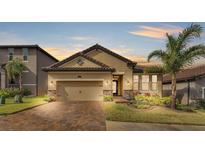 Beautiful craftsman style home with a 2 car garage and lush landscaping at 4224 Prima Lago Dr, Lakeland, FL 33810