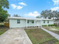 Newly renovated home with a landscaped yard and driveway at 4517 Oak St, Lakeland, FL 33813