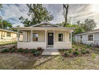 Newly renovated house featuring a front porch and well-manicured landscaping at 638 W Thomas St, Lakeland, FL 33805