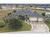 Aerial view of a single-Gathering home with a large backyard and three-car garage at 2774 Verandah Vue Way, Lakeland, FL 33812