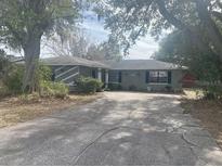 House exterior showing front yard, driveway, and landscaping at 3638 W Wheeler Rd, Lakeland, FL 33810