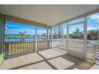 Relaxing screened porch overlooking a lake at 4938 Deerwood Dr, Lakeland, FL 33810