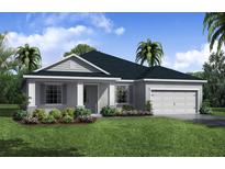 Single-story home with gray exterior, dark roof, and landscaping at 5451 Duxford Cir, St Cloud, FL 34771