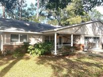 Single story home with attached garage and large front yard at 8655 Sw 98Th Street Rd # A, Ocala, FL 34481