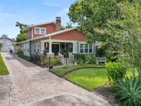 Charming craftsman home with landscaped yard and brick driveway at 304 E Palm Dr, Lakeland, FL 33803