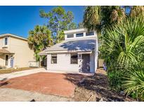 Charming single-Gathering home featuring a metal roof and mature trees at 3544 Raintree Cir, Lakeland, FL 33803