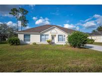 Charming single-story home featuring a well-maintained lawn and traditional architectural details at 519 Eagle Ct, Kissimmee, FL 34759