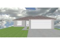 Exterior elevation of a single-story home with a two-car garage and well-maintained lawn at 0 Robinson Dr, Haines City, FL 33844