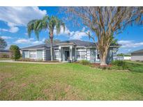 Charming single story home with well manicured lawn, mature landscaping and inviting curb appeal at 6846 Ashbury Dr, Lakeland, FL 33809