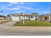 Charming single-story home with well-maintained lawn and attached one car garage at 3102 Pebble Bend Dr, Lakeland, FL 33810