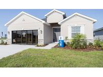 Charming single-story home with well-manicured lawn and inviting entrance at 706 Bentley North Loop, Auburndale, FL 33823