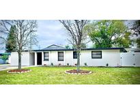 Charming single-story home with fresh exterior paint and manicured front lawn at 2521 Coral Way, Lakeland, FL 33801