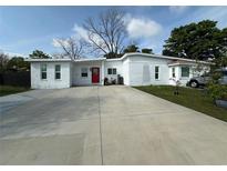 Charming one-story brick home with well-maintained landscaping and a spacious driveway at 1771 Bayview Dr, Lakeland, FL 33805
