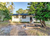 Charming single-story home featuring fresh paint, manicured landscaping, and a welcoming entrance at 5420 Ivory Ln, Lakeland, FL 33811