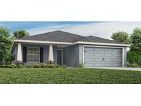 Charming single-story home featuring a two-car garage, covered entry, and well-manicured lawn at 1794 Daystar Dr, Haines City, FL 33844