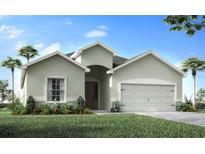 Inviting one-story home featuring lush landscaping, a two-car garage, and an arched entryway at 1867 Daystar Dr, Haines City, FL 33844