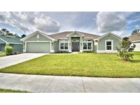 Charming single-story home boasts a well-manicured lawn and inviting curb appeal at 4062 Tullamore Ln, Auburndale, FL 33823