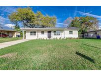 Charming single-story home features a well-maintained lawn and cozy curb appeal at 2924 Bellwood Ave, Lakeland, FL 33803