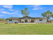 Charming single-story home with a welcoming front porch and a large, well-maintained lawn at 1535 Walker Rd, Lakeland, FL 33810