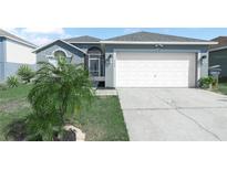 Charming single-Gathering home with a two-car garage and mature landscaping in a desirable neighborhood at 300 Keswick Ave, Davenport, FL 33897