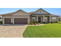 Charming single-story home featuring a well-manicured lawn and a spacious two car garage at 5020 Truman Ln, Lakeland, FL 33812
