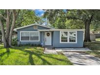 Charming single-story home with light blue siding and a well-maintained front yard at 1028 W Marjorie St, Lakeland, FL 33815
