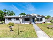 Charming single-story home with a well-maintained front yard and a cozy porch, offering great curb appeal at 1504 Glendale St, Lakeland, FL 33803