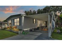 Charming single-story home with covered parking, patio area, and well-maintained landscaping at 1610 Reynolds Rd # 50, Lakeland, FL 33801