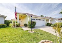 Charming single-story home with an attached two-car garage and well-maintained landscaping at 3080 Westmoreland Dr, Lakeland, FL 33810