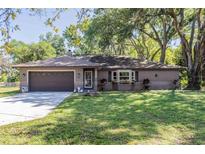 Charming single story home with a well-manicured lawn and attached two car garage at 530 Heather Ct, Bartow, FL 33830