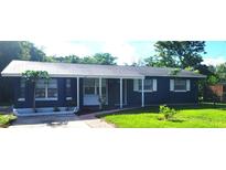 Charming one story home featuring a front yard and updated landscaping at 1024 31St Nw St, Winter Haven, FL 33881