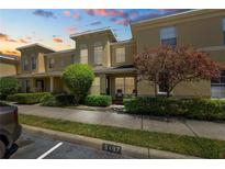 Charming townhome featuring well-maintained landscaping and inviting front porch seating at 5407 River Rock Rd # 5407, Lakeland, FL 33809