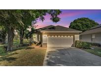 Charming home featuring a well-manicured lawn and a two-car garage, inviting curb appeal at 6775 Lake Clark Dr, Lakeland, FL 33813