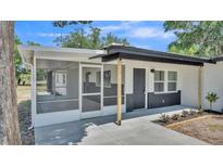 Charming single-story home featuring a screened porch and freshly painted exterior accents at 1650 W Mcleod St, Bartow, FL 33830