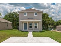 Inviting two-story home with a quaint covered porch and well-maintained front lawn at 4189 Radford Rd, Bartow, FL 33830