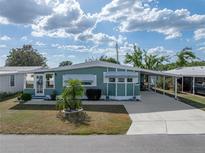 Charming single-story home with a covered carport and well-maintained landscaping at 5016 Forest Crest Dr, Lakeland, FL 33810