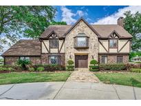 Charming two-story home with stone facade, detailed trim, and lush landscaping at 3906 Canyon Lake Pt, Lakeland, FL 33813