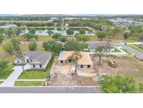New construction home with a pond view, situated in a community with lush landscaping at 505 Shanklin Ave, Bartow, FL 33830